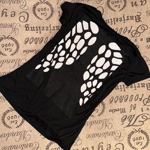 Laser cut out wings on black shirt